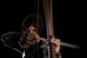 Medieval archer in front.