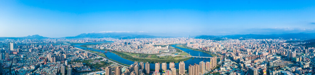 Fototapeta premium Taipei City Aerial View - Asia business concept image, panoramic modern cityscape building bird’s eye view under daytime and blue sky, shot in Taipei, Taiwan.