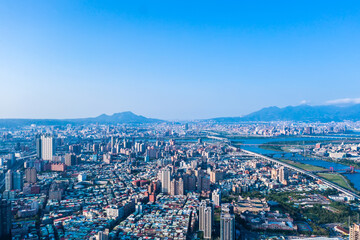 Fototapeta na wymiar Taipei City Aerial View - Asia business concept image, panoramic modern cityscape building bird’s eye view under daytime and blue sky, shot in Taipei, Taiwan.