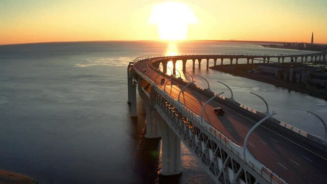High-speed toll road, highway bypassing the city center St. Petersburg, the central section of the western high-speed section. A beautiful view of the sunset over the Gulf of Finland.