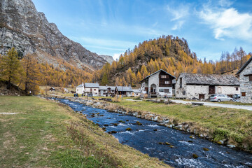 Fototapeta na wymiar The colours of autumn at the Alpe Devero in Crampiolo, little village in the mountains