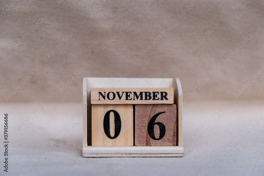 Fototapete november 6th. image of november 6 wooden color calendar on white canvas background. empty space for 