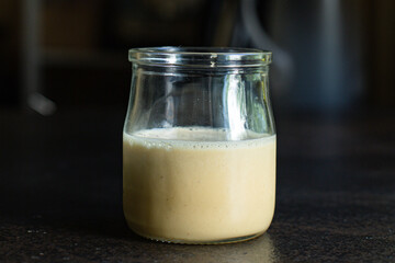 cream honey in a transparent jar on the table sweet healthy dessert tasty serving size portion top view copy space for text food background rustic