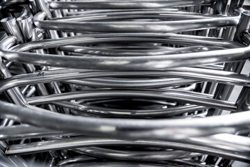 Abstract industrial background of metal pipes construction.