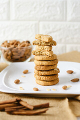 Stack of Gluten Free Almond Cookies set on white cafe table.