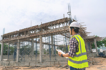 architect or construction engineers work in the construction site