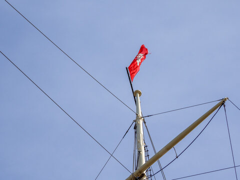 at a end of a sail mast the red flag of Hamburg