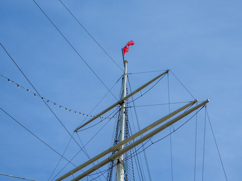 at a end of a sail mast the red flag of Hamburg