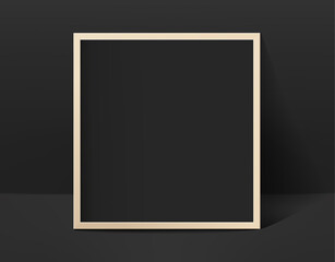 Black photo frame in black interior. Template for design