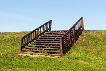 Wooden stairs leading to the sky.