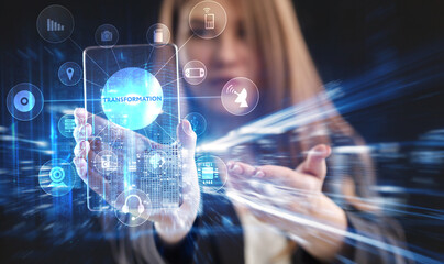 Business, Technology, Internet and network concept. Young businessman working on a virtual screen of the future and sees the inscription: Transformation