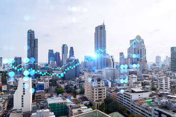Obraz premium Forex and stock market chart hologram over panorama city view of Bangkok, the financial center in Asia. The concept of international trading. Double exposure.