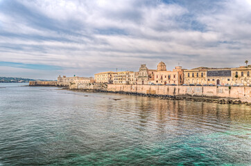 Syracuse Sicily/ Italy -April 11 2020: The breathtaking scenery of the Ortigia seafront in Syracuse Sicily