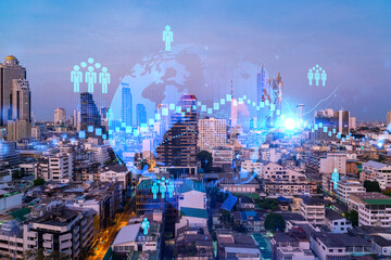 Fototapeta na wymiar Hologram of social media icons over sunset panoramic cityscape of Bangkok, Asia. The concept of people connections. Multi exposure.