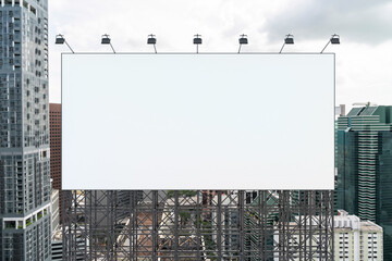 Obraz premium Blank white road billboard with Singapore cityscape background at day time. Street advertising poster, mock up, 3D rendering. Front view. The concept of marketing communication to promote.