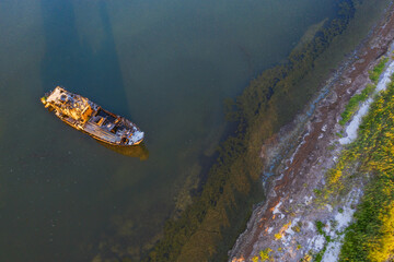aerial view to the old shipwreck near the coast with copy space