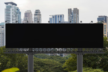 Blank black road billboard with Bangkok cityscape background at day time. Street advertising poster, mock up, 3D rendering. Front view. The concept of marketing communication to promote or sell idea.