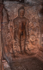cave sculptures of jain gods carved on walls ancient stone art in details