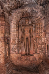 cave sculptures of jain gods carved on walls ancient stone art in details