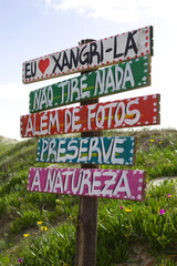 Indicative sign on access to Xangri-la beach in Brazil