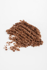 A sample of coffee scrub isolated on a white background close-up. Cosmetology, personal care.