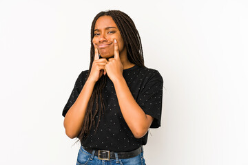 Young african american woman isolated on white background doubting between two options.