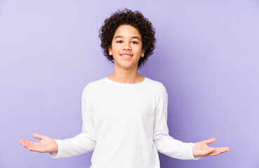African american little boy isolated showing a welcome expression.