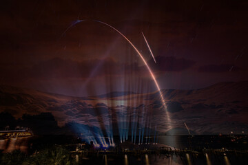 Missile launch, spotlight illumination. Elements of this image furnished by NASA.