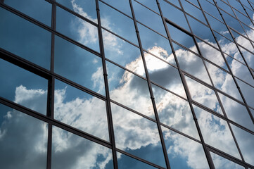 Background series: Closeup of glass skyscraper reflecting blue sky