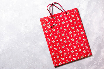 Red gift package paper bag. Happy New Year. Flat lay, top view, copy space