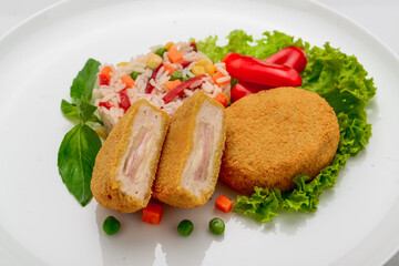Chicken meatballs in batter with ham and risotto