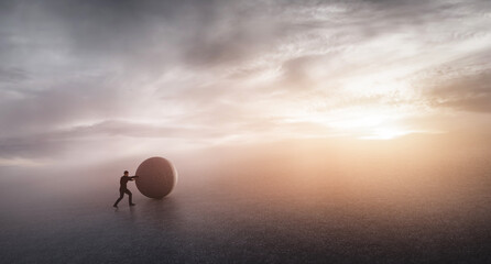 Businessman pushing heavy rock. © Photocreo Bednarek