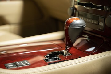 Car detailing series: Closeup of automatic wooden gearstick