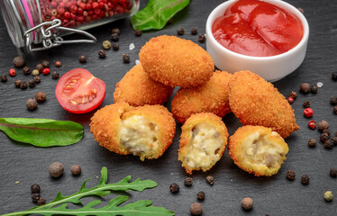 Fried mozzarella, cheddar cheese bites, balls with ketchup