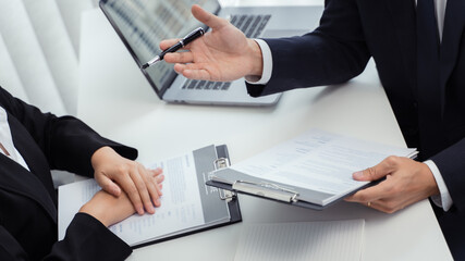 Job candidate with resume job interview to human resource manager.