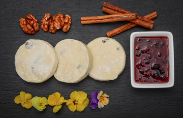 Fototapeta premium Cottage cheese pancakes and strawberry sauce. Frozen food