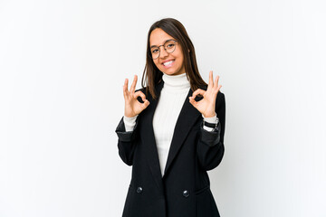 Young mixed race business woman isolated on white background cheerful and confident showing ok gesture.