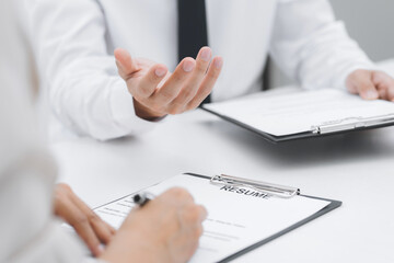 Job candidate with resume job interview to human resource manager.