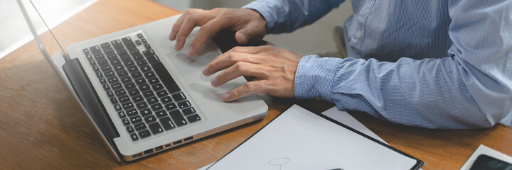 Business accountant working with laptop in office.