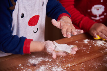 brother and sister prepare homemade cookies in the kitchen. The mood of the occasion. Fun and...