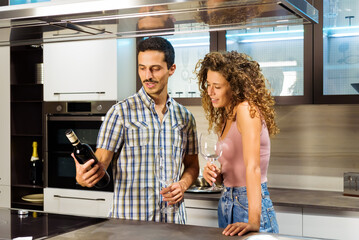 Young couple checking a bottle of wine