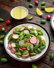Cucamelon radish salad on rustic wooden table. healthy summer food
