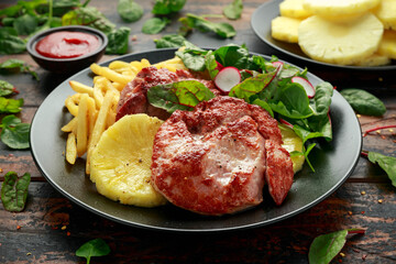 Fried Gammon steak with pineapple, french fries and vegetables