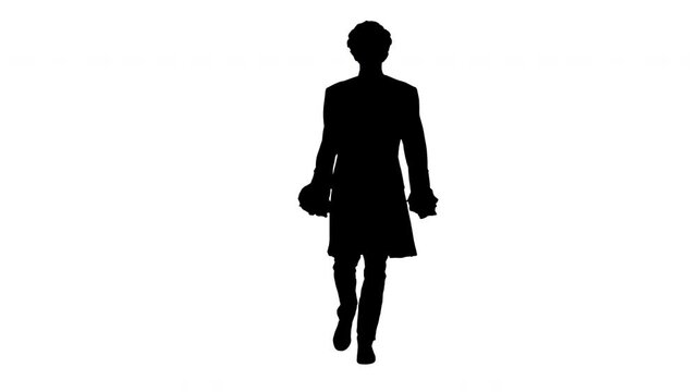 Silhouette Man in old-fashioned laced frock coat and white wig walking in a mannered way looking at camera.