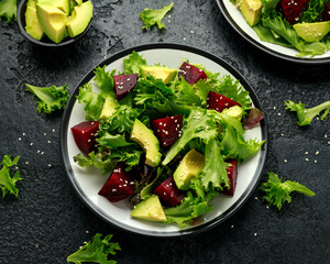 Vegetarian avocado and beet salad in plate. Healthy vegan food