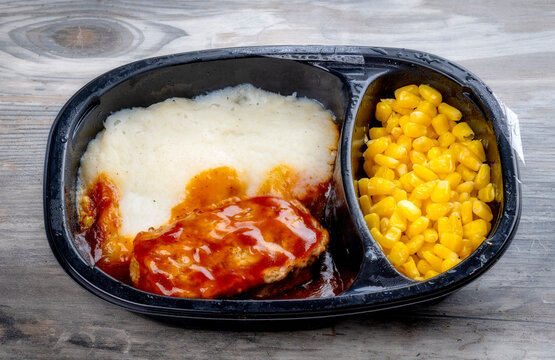 Delicious Meatloaf TV dinner in a black plastic tray