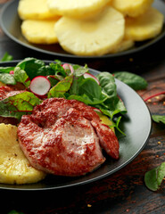 Fried Gammon steak with pineapple, french fries and vegetables