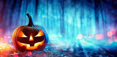Foto op Plexiglas Pumpkin In Defocused Spooky Forest At Night - Halloween Concept  © Romolo Tavani