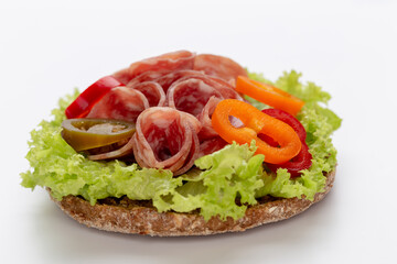 Sandwich with salami sausage on white background.