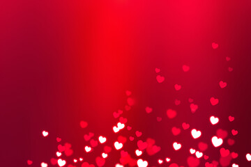 Glowing white hearts with bokeh effect